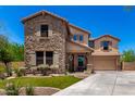 Charming two-story home featuring stone accents, a covered porch and a two car garage at 3760 W Lapenna Dr, New River, AZ 85087