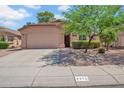 Charming single-story home with a two-car garage, attractive xeriscaping, and a well maintained lawn at 4350 E Gatewood Dr, Phoenix, AZ 85050
