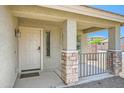 Charming front porch with stone accents on the columns and a welcoming entrance at 45311 W Woody Rd, Maricopa, AZ 85139