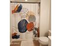 Neutral bathroom with shower/tub combo and updated shower curtain at 5345 E Van Buren St # 116, Phoenix, AZ 85008