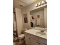 Bathroom featuring a white vanity with a white marble countertop at 5345 E Van Buren St # 116, Phoenix, AZ 85008