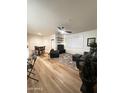 Open-concept living room with a dining area, modern furnishings, and ample natural light at 5345 E Van Buren St # 216, Phoenix, AZ 85008
