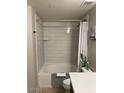 Bathroom with white subway tile surround, modern fixtures, and a shower-tub combination at 5345 E Van Buren St # 370, Phoenix, AZ 85008