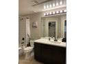Contemporary bathroom with a large vanity, ample lighting, and a shower-tub combination at 5345 E Van Buren St # 370, Phoenix, AZ 85008