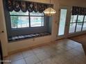Cozy breakfast nook with a window seat overlooking the outdoor pool at 7420 W Morrow Dr, Glendale, AZ 85308