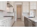 Well-equipped kitchen with white cabinets, stainless appliances, granite countertops and a dark contrasting island at 10013 S 36Th Ave, Laveen, AZ 85339