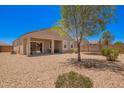 Spacious backyard with covered patio, desert landscaping, and room for outdoor activities at 1254 E Thomas Dr, Casa Grande, AZ 85122