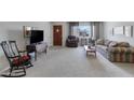Inviting living room with natural light and traditional furnishings at 1559 S Padre Rd, Apache Junction, AZ 85119