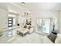 Bright and open living room featuring neutral decor, sliding glass doors, and modern flooring at 16414 S 36Th St, Phoenix, AZ 85048