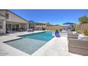 Inviting pool area with a baja shelf, a spa, a built in bbq and outdoor lounge at 3118 E Gary Way, Phoenix, AZ 85042
