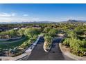 Community aerial view showcasing the landscape, streets, houses, and distant mountains at 5434 E Barwick Dr, Cave Creek, AZ 85331