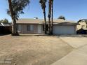 Charming single-story home with a spacious front yard and desert landscaping, offering curb appeal at 808 N 67Th Ln, Phoenix, AZ 85043