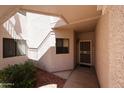 Inviting covered entry to unit 162 with shade and desert landscaping at 9151 W Greenway Rd # 162, Peoria, AZ 85381