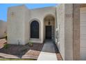 Inviting entryway with a decorative window and a secure, gated front door at 9313 W Morrow Dr, Peoria, AZ 85382