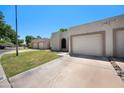 Lovely single-story home with a well-maintained lawn and attached two-car garage at 9313 W Morrow Dr, Peoria, AZ 85382