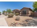 Charming one-story home featuring desert landscaping and a well-maintained front yard at 10009 W Raymond St, Tolleson, AZ 85353