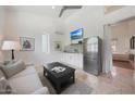 Cozy living area featuring modern furnishings, a kitchenette, and access to an attached bedroom at 10152 E Phantom Way, Scottsdale, AZ 85255