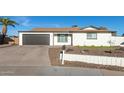 Charming single-story home with a well-maintained front yard and desert landscaping at 12043 N 46Th Ave, Glendale, AZ 85304