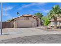 Lovely single-story home with a tile roof, desert landscaping, and an attached two-car garage at 1245 W Cindy St, Chandler, AZ 85224
