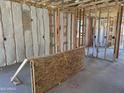 Interior framing with insulation, electrical, and plumbing, showcasing construction phase at 18224 W La Senda Dr, Surprise, AZ 85387