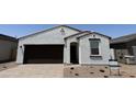Charming single-story home with a neutral color palette and low maintenance landscaping at 18240 W La Senda Dr, Surprise, AZ 85387