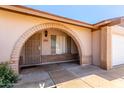 A close-up of the front entrance, which has an arched entrance at 4845 W Sweetwater Ave, Glendale, AZ 85304