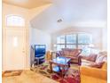 Bright living room featuring tile flooring and a large window for ample natural light at 6415 W Escuda Rd, Glendale, AZ 85308
