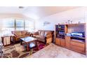 Cozy living room with tile flooring and a large window for natural light at 6415 W Escuda Rd, Glendale, AZ 85308