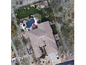 Expansive aerial view showcases the home's lush backyard, private pool, and outdoor pergola at 11320 E Winchcomb Dr, Scottsdale, AZ 85255