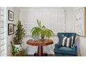 Cozy sitting area featuring plantation shutters, wooden table, chair and natural light at 2236 E Sierra St, Phoenix, AZ 85028