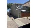 Exterior shot of a two-story unit featuring neutral siding, a satellite dish, and low maintenance landscaping at 2301 E University Dr # 280, Mesa, AZ 85213