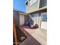 Charming front patio with light pink adirondack chairs and a hexagon brick patio at 2301 E University Dr # 280, Mesa, AZ 85213