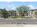 A parking lot in front of the townhouses with guest parking and handicapped parking spot at 2401 E Rio Salado Pkwy # 1047, Tempe, AZ 85288