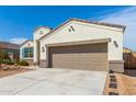 Attached two-car garage with neutral trim and ample parking on the concrete driveway at 30128 W Weldon Ave, Buckeye, AZ 85396