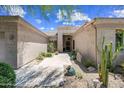 Front entrance with desert landscaping creating a welcoming entrance to the property at 33317 N 71St St, Scottsdale, AZ 85266