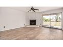Inviting living room features a fireplace and sliding glass doors to patio at 7061 E Broadway Rd # 48, Mesa, AZ 85208
