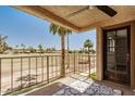 Relaxing patio with golf course views and decorative outdoor rug at 7061 E Broadway Rd # 48, Mesa, AZ 85208