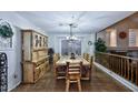 Cozy dining room with rustic wooden furniture and decorative antler chandelier at 8026 W Villa Lindo Dr, Peoria, AZ 85383