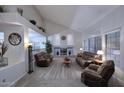 Bright living room with high ceilings, fireplace, and lots of natural light at 8026 W Villa Lindo Dr, Peoria, AZ 85383