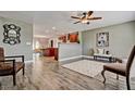 Open-concept living space featuring wood floors and seamless transition to dining and kitchen at 1045 S Solomon St, Mesa, AZ 85204