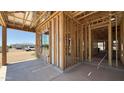 Spacious garage with wood framework ready for customization providing ample parking and storage space at 11338 E Utah Ave, Mesa, AZ 85212