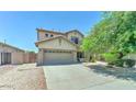 Attractive two-story home showcases a two-car garage, tidy landscaping, and a welcoming facade at 11633 W Jefferson St, Avondale, AZ 85323
