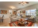 Open floor plan boasts two seating areas, tile floors, and lots of natural light at 1552 E Manor Dr, Casa Grande, AZ 85122