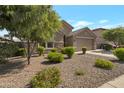 Single-Gathering home showcasing desert landscaping at 18837 W San Juan Ave, Litchfield Park, AZ 85340