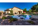 Spacious backyard with private pool, patio and desert landscaping, perfect for outdoor entertaining at 2004 N 125Th Ave, Avondale, AZ 85392