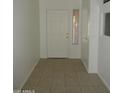 Clean, bright tiled front entrance with neutral walls at 22632 W Solano Dr, Buckeye, AZ 85326