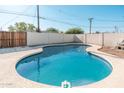 Backyard pool with refreshing blue water with a tan border and white surrounding fence at 2342 N 40Th Ave, Phoenix, AZ 85009