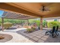 Inviting covered patio with a ceiling fan, outdoor seating, and a decorative pergola at 26333 W Vista North Dr, Buckeye, AZ 85396