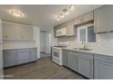 Modern kitchen with stainless steel appliances, sleek countertops, and ample cabinet space at 2853 W Ohio St, Apache Junction, AZ 85120