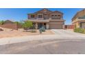 Two-story home featuring desert landscaping, a two-car garage and a neutral color scheme at 36645 W Bilbao St, Maricopa, AZ 85138